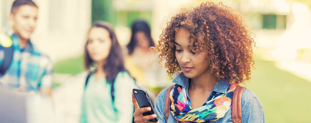 Young adult looking at cell phone