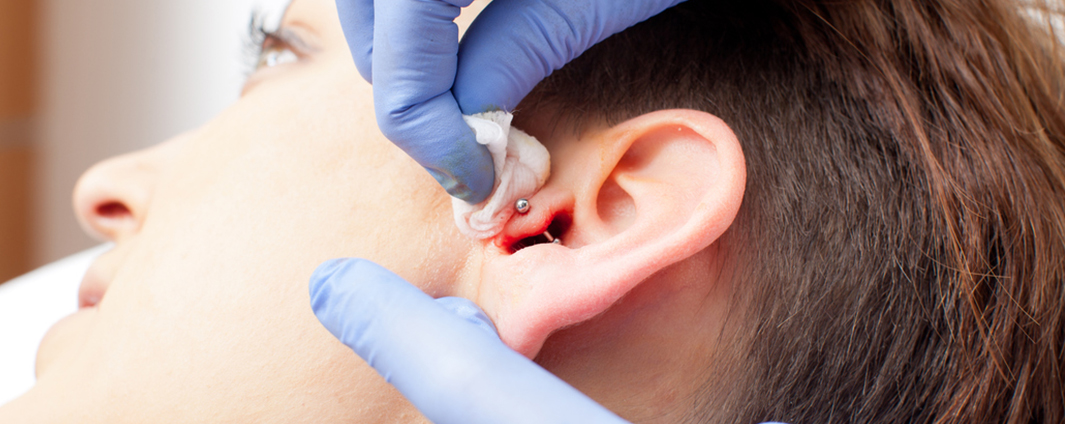 Client get her ears pierced